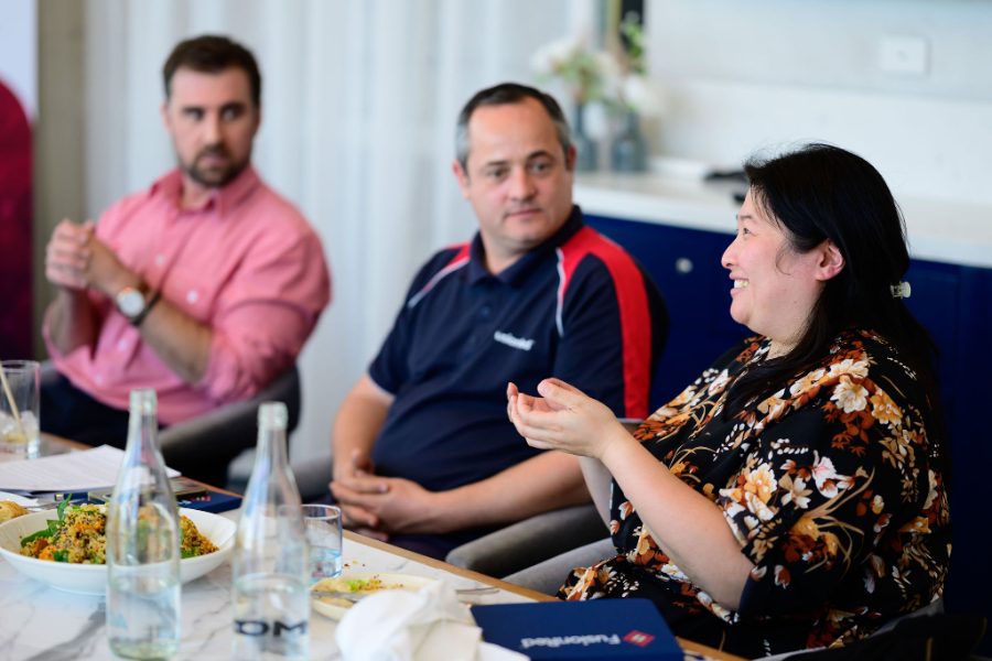 Clients laughing together at a FusionRed event
